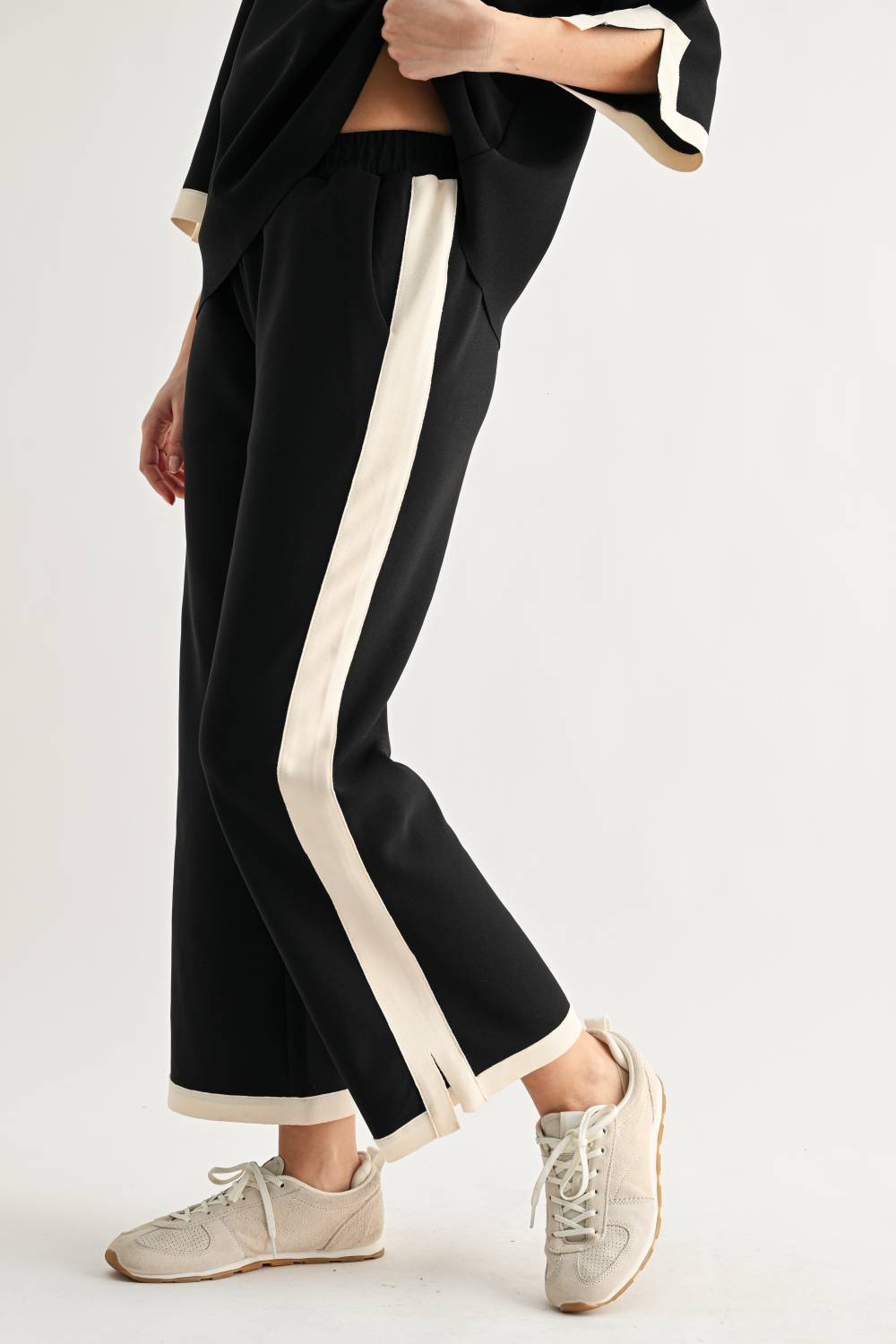 Kristopher black wide-leg pants with cream contrast side stripe and elastic waistband