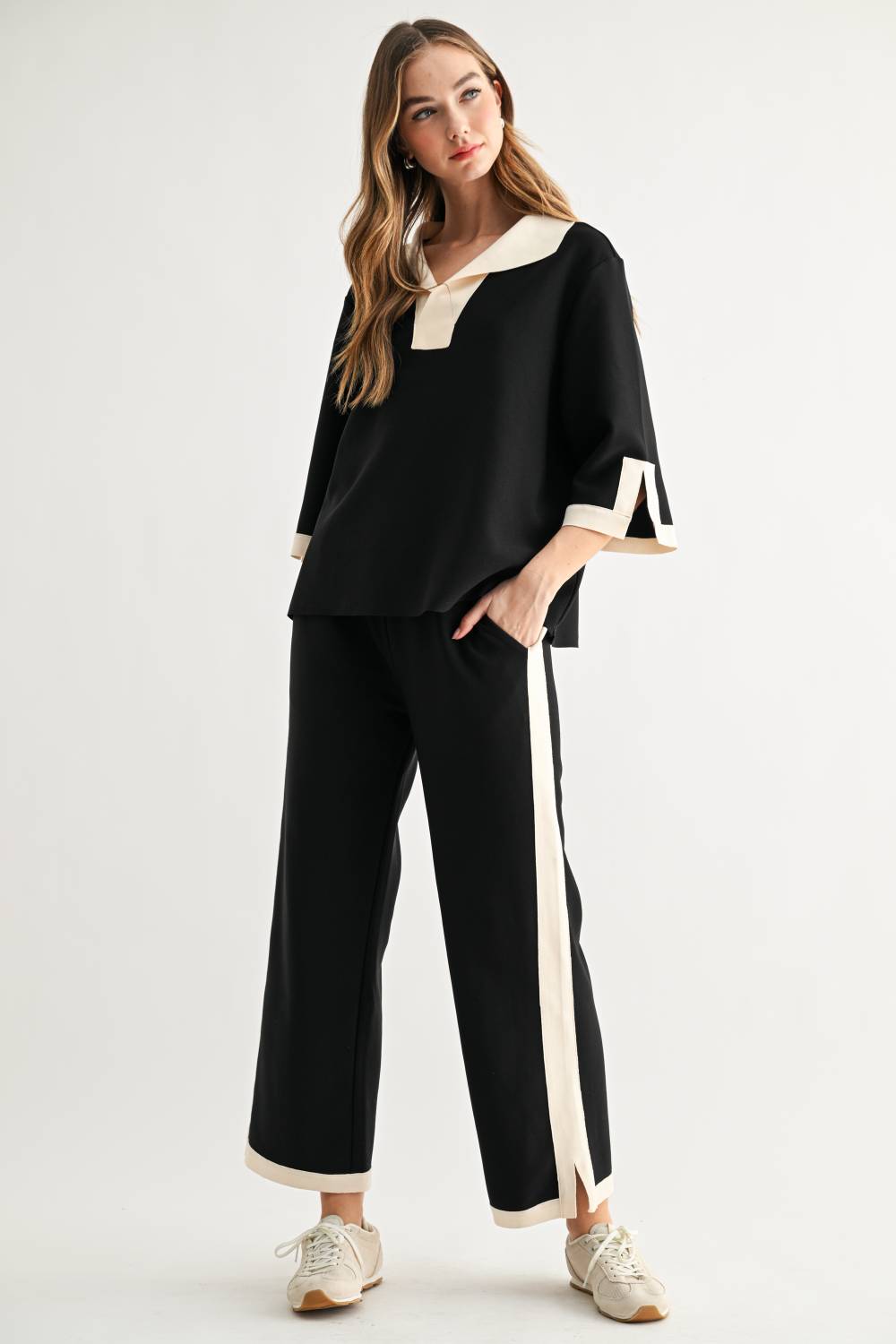 Women’s black wide-leg pants with cream side stripe and contrast hem trim