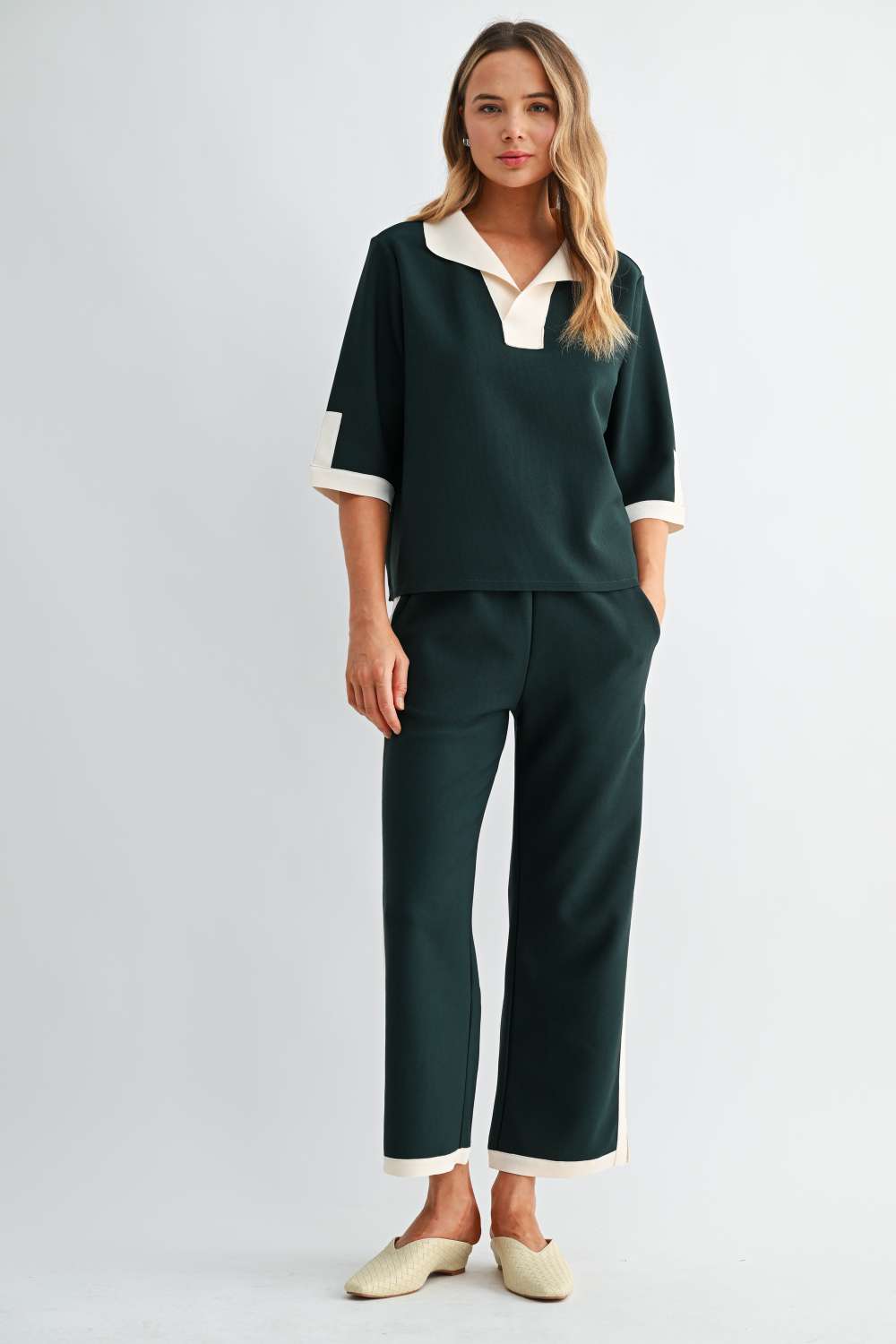 Women’s forest green wide-leg pants with cream side stripe and contrast hem trim