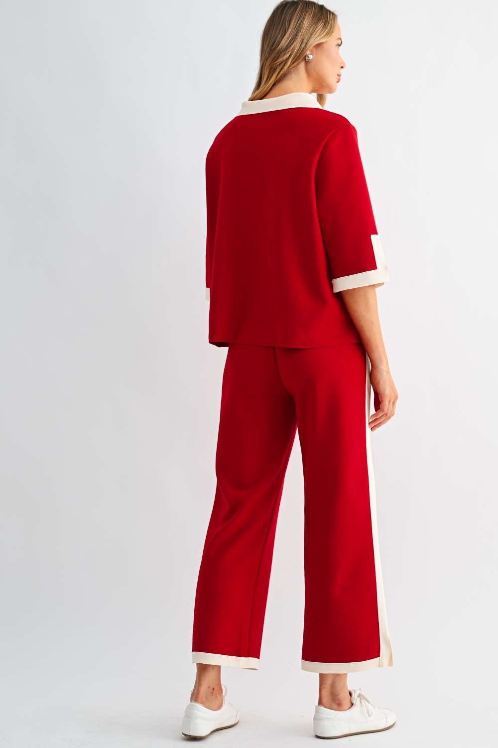 Back view of Kristopher red wide-leg pants with cream contrast stripe