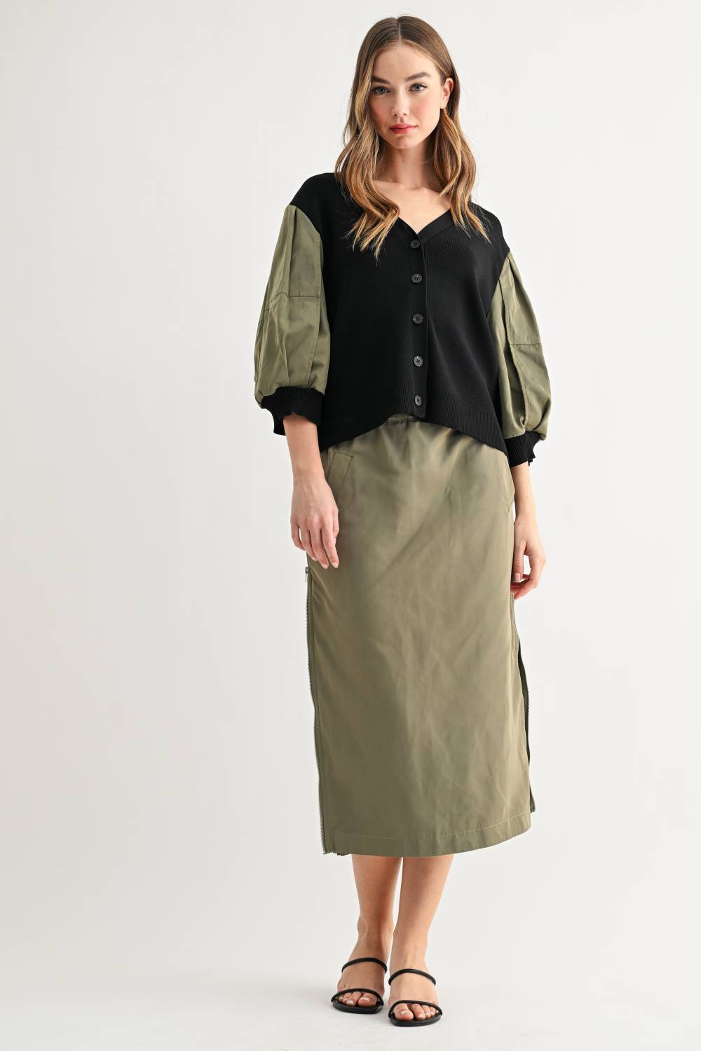 Simon olive and black balloon sleeve cardigan styled with matching skirt