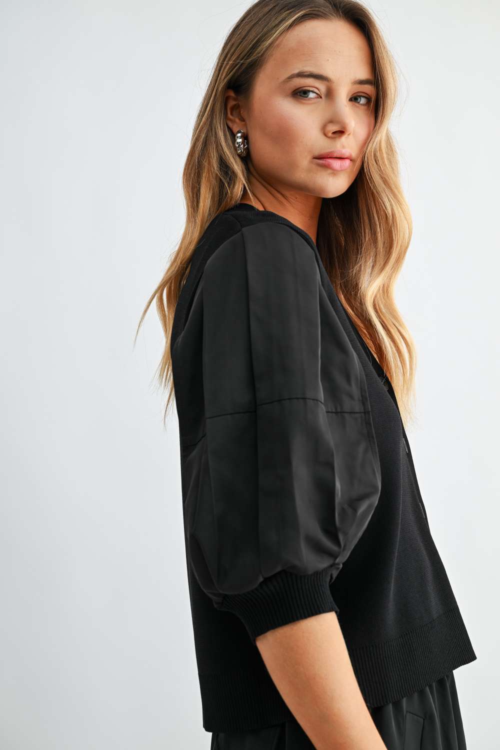 Side view of Simon black woven balloon sleeve cardigan