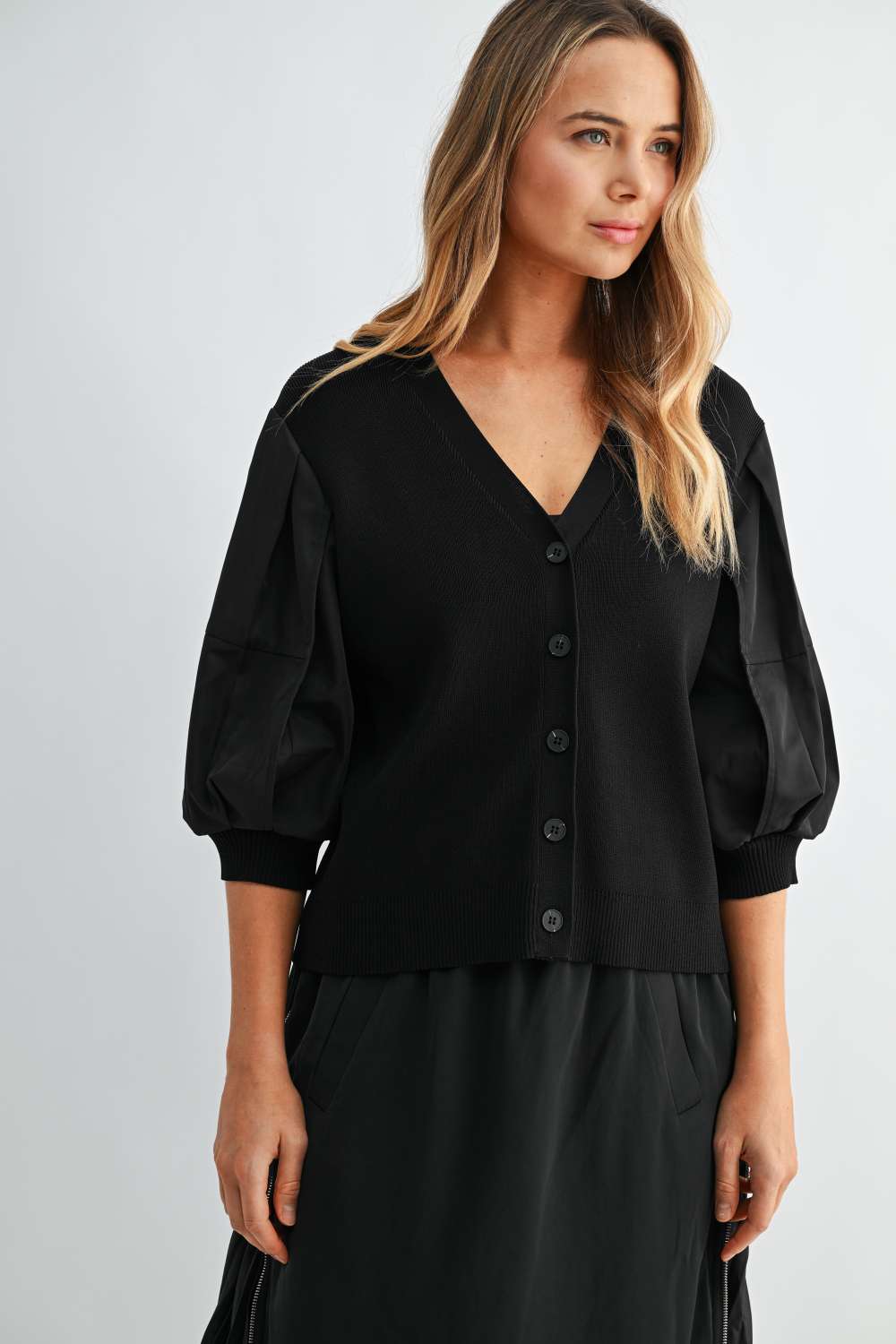 Women’s black V-neck cardigan with balloon sleeves and button-front closure